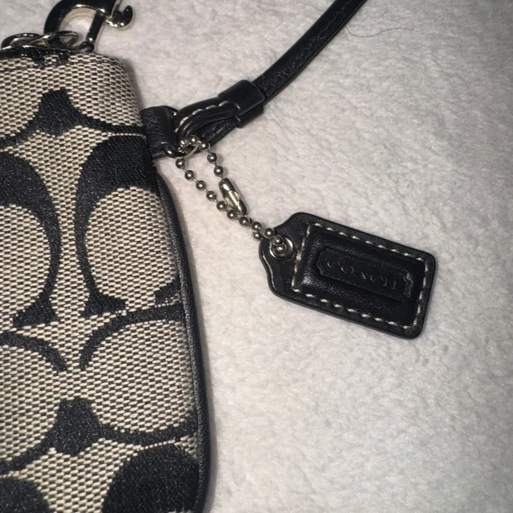 Coach Black and Tan Signature Canvas Wristlet